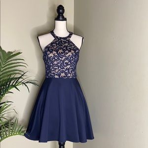 Blue embroidered spaghetti strap dress.